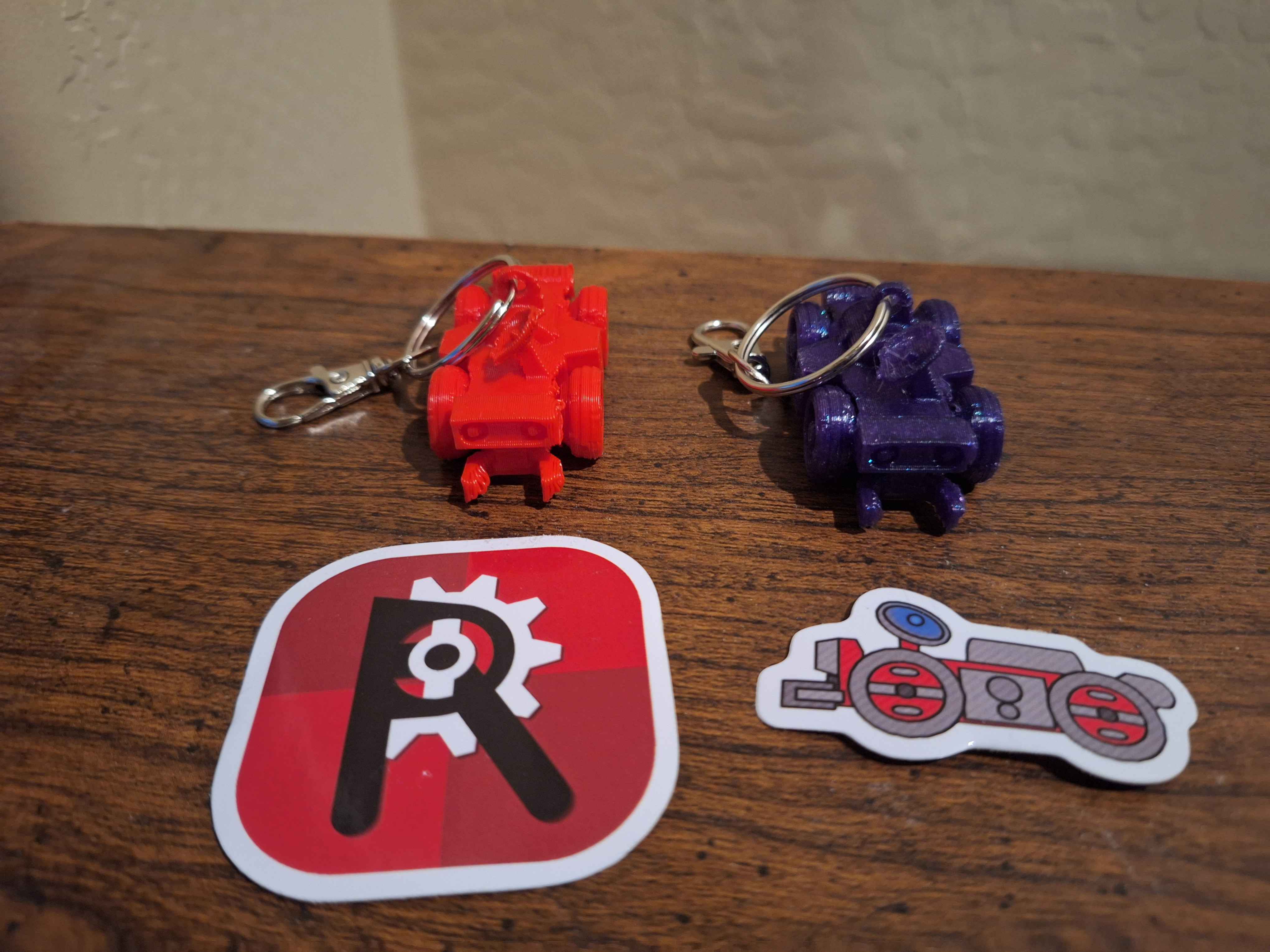 Custom Roverdrive stickers and 3D-printed rover keychains we gave out at the booth